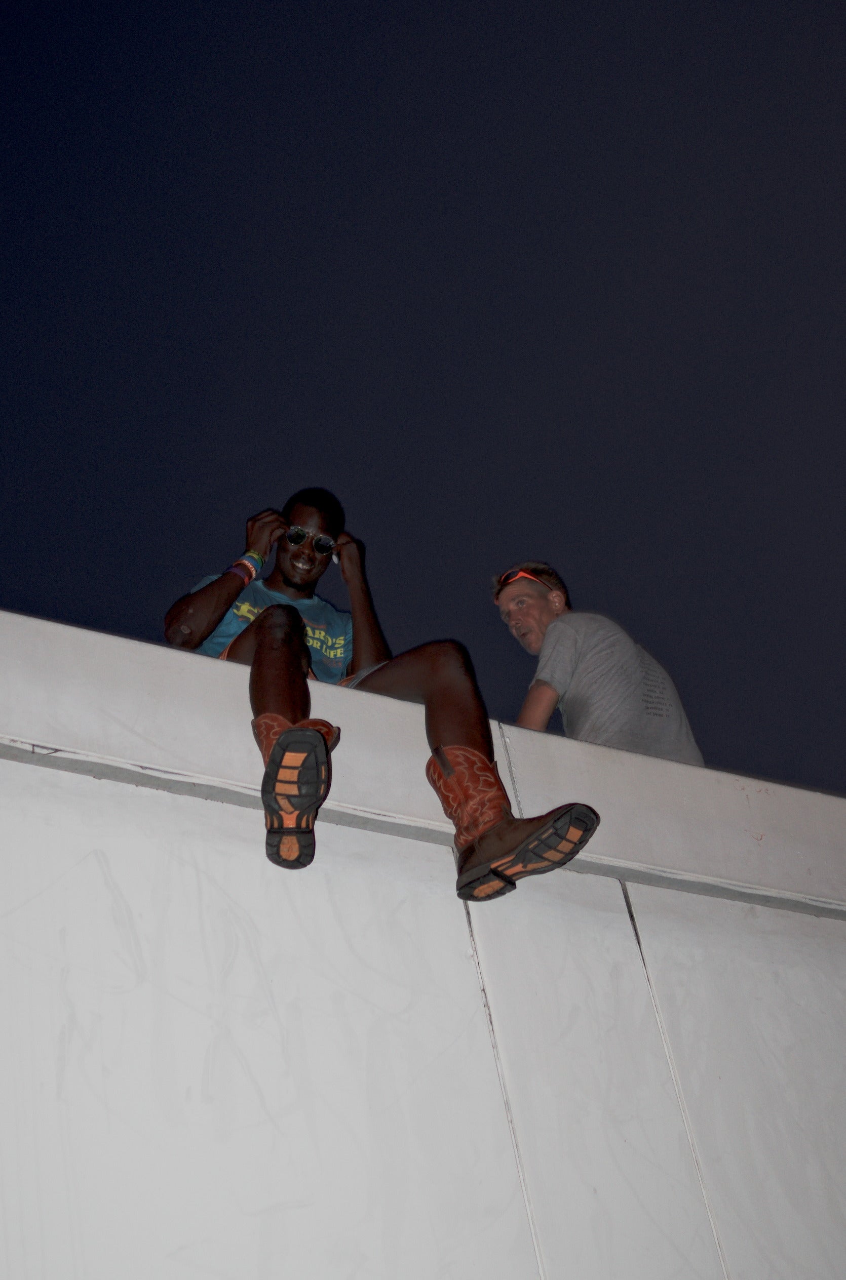 Two people on a rooftop at night. Acacia Cinematography, Tampa, Fl 