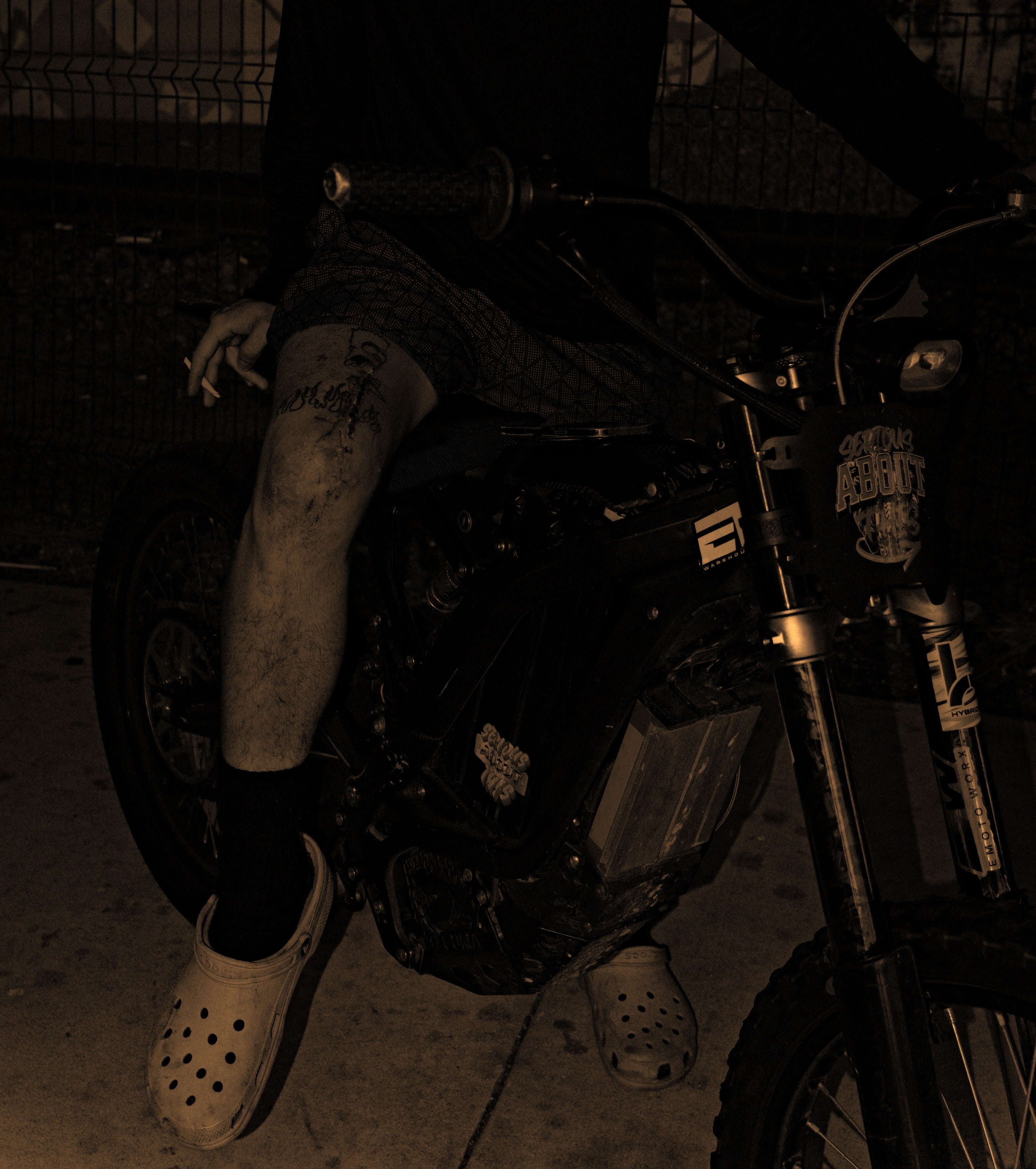 Person sitting on a motorcycle in a dark setting. Acacia Cinematography, Tampa, Fl 