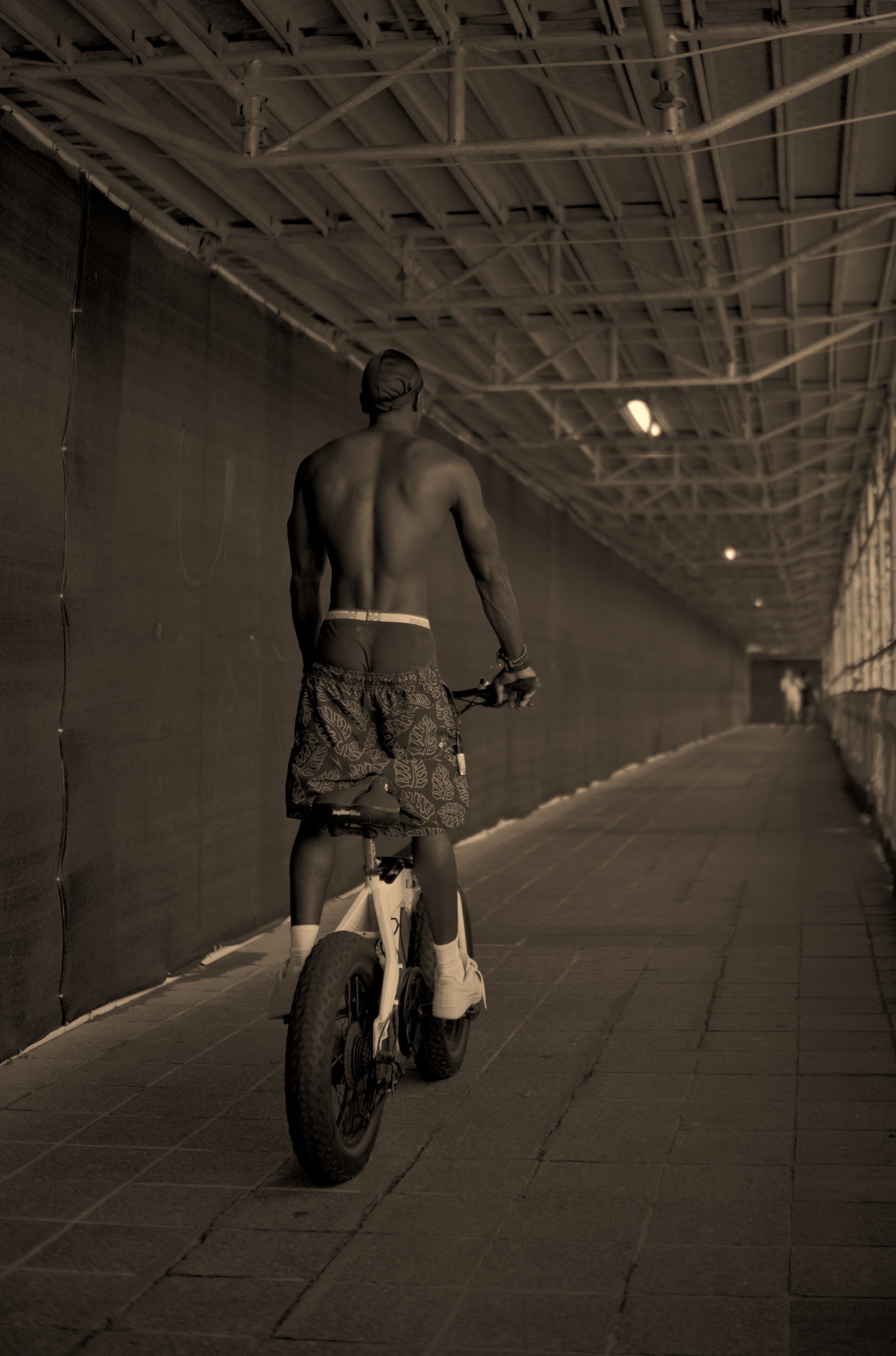 Man riding his bike on the Riverwalk. Acacia Cinematography, Tampa, Fl 